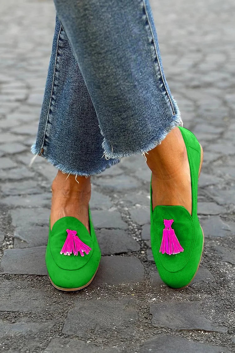 Green Loafer with a vibrant fuchsia tassel