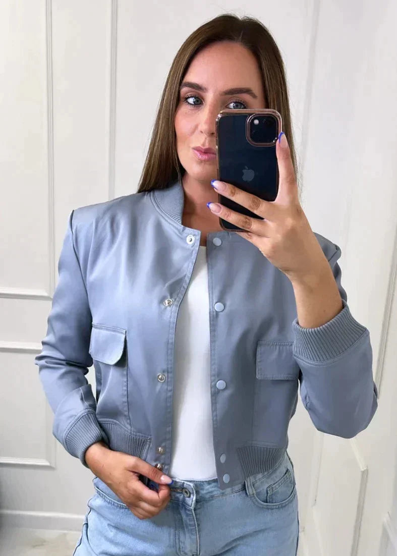 Elegant navy blue bomber jacket for women, perfect for a sophisticated casual look