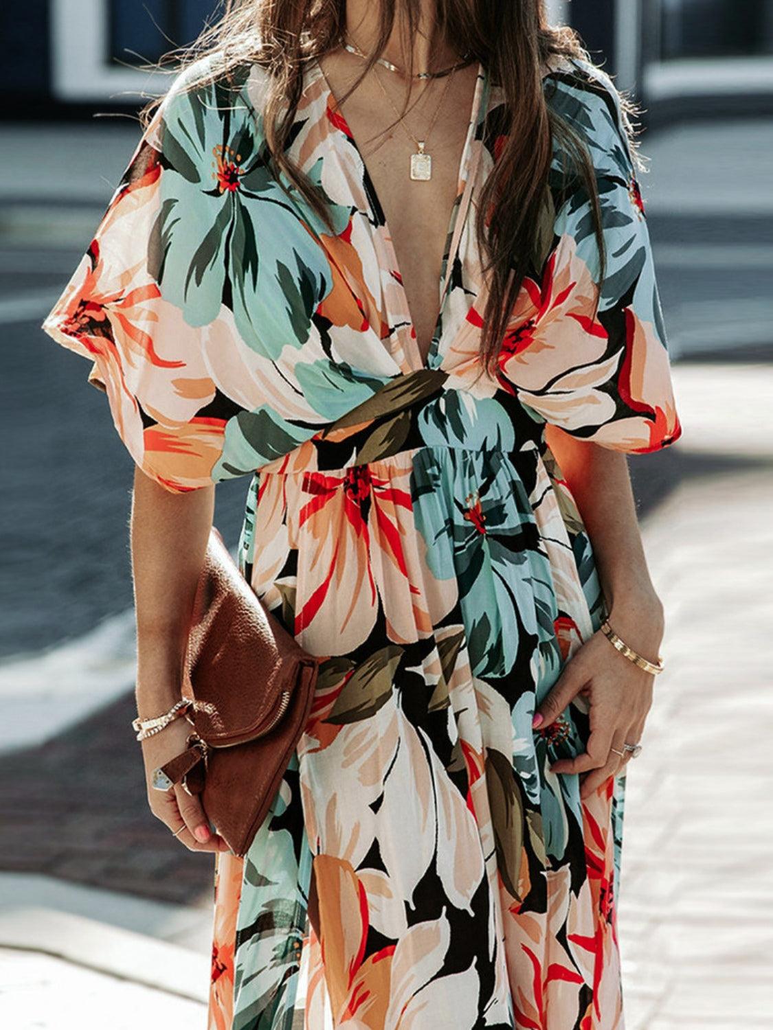 Floral dress with plunging neckline and three-quarter sleeves