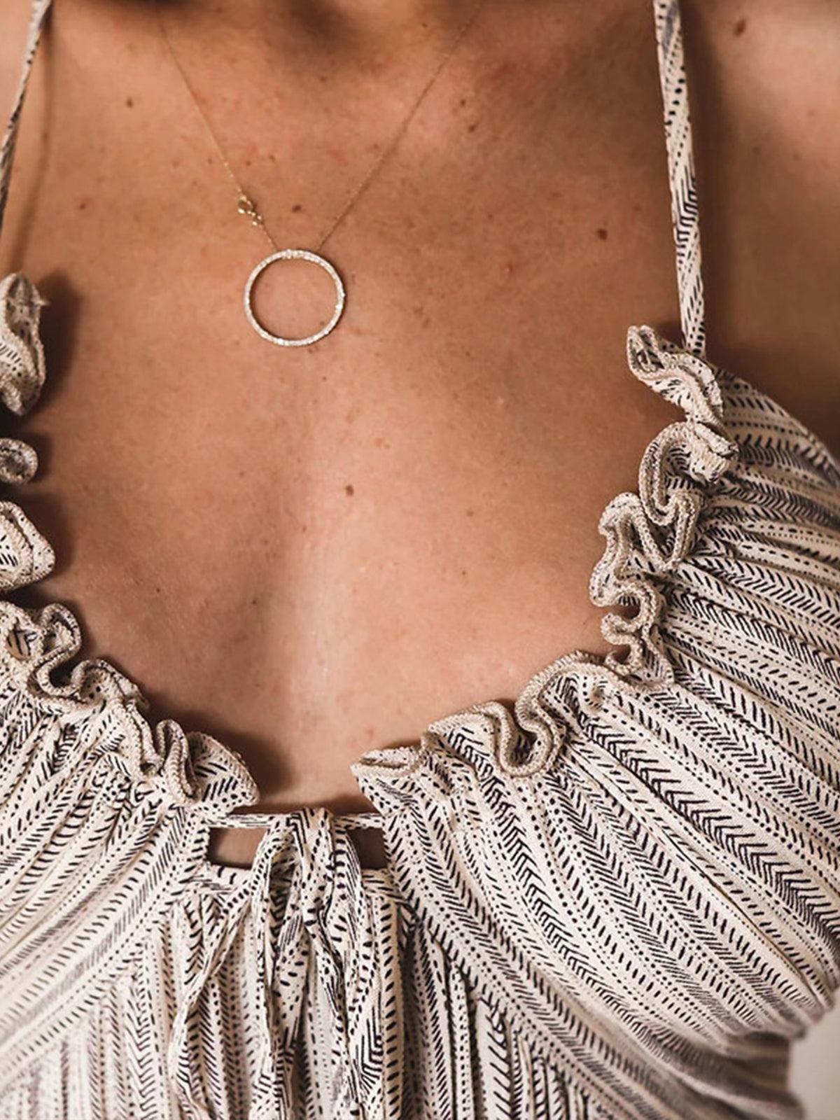 Elegant backless long dress with a U-neckline and crisscross straps