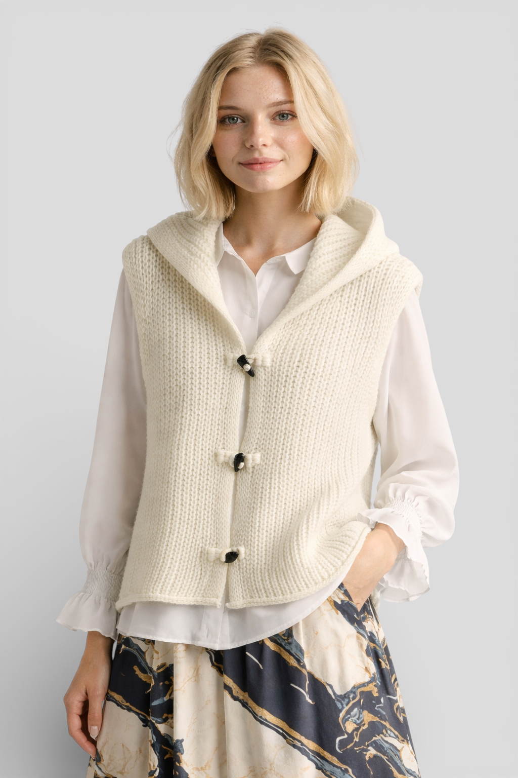 Camila - Elegant sleeveless hooded knit fashion for a sophisticated look