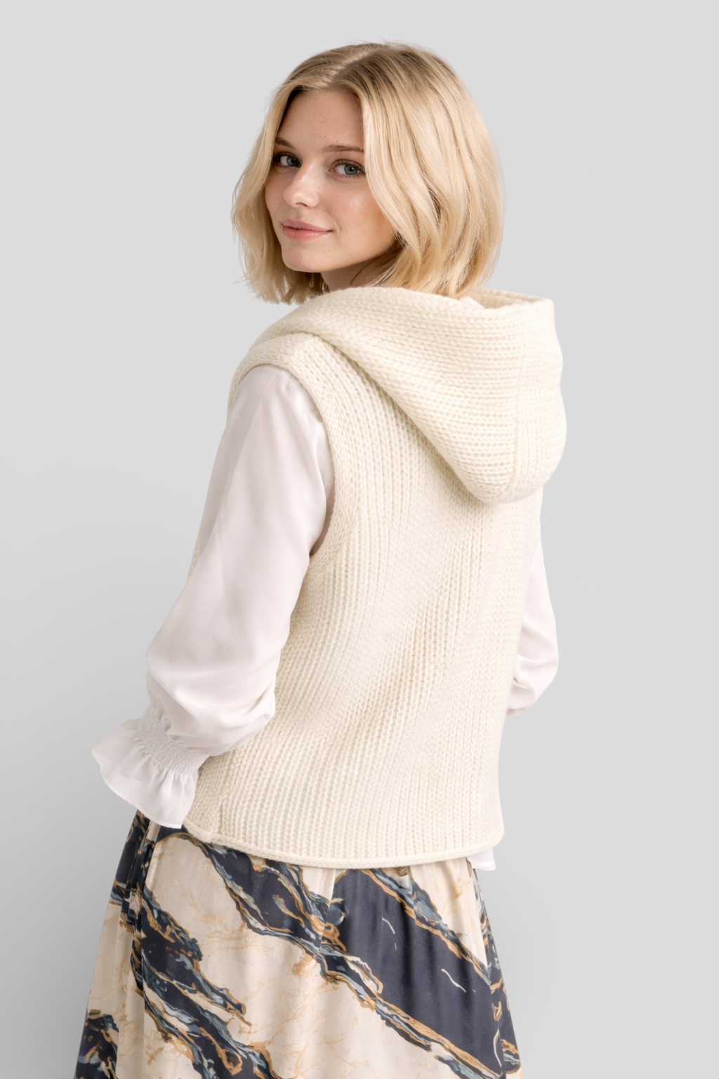 Camila - Elegant sleeveless hooded knit fashion for a sophisticated look