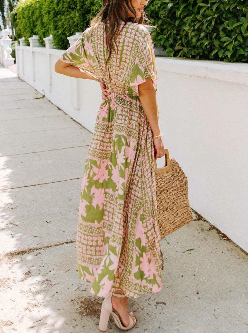 Floral dress with plunging neckline and three-quarter sleeves