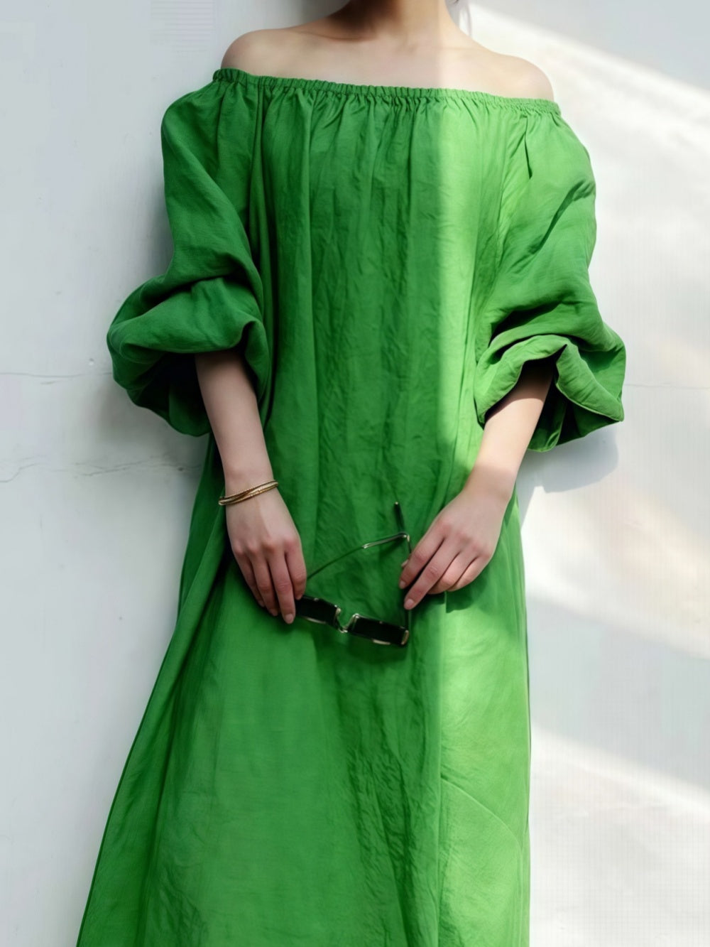 Casual loose-flowing off-the-shoulder dress in solid color