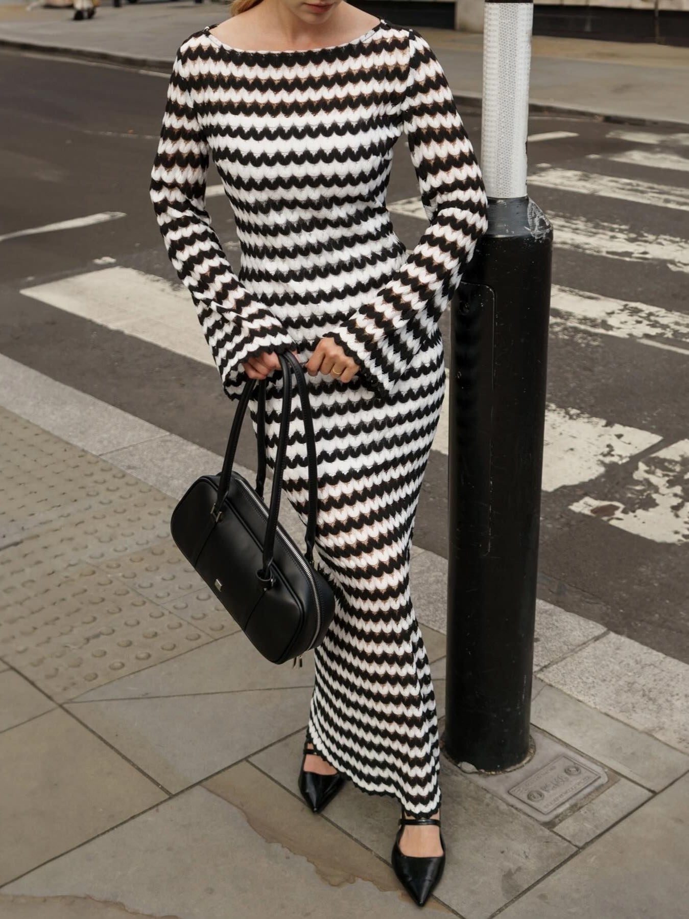 Knit dress with round neckline, asymmetrical and elegant with slit detail for a trendy look