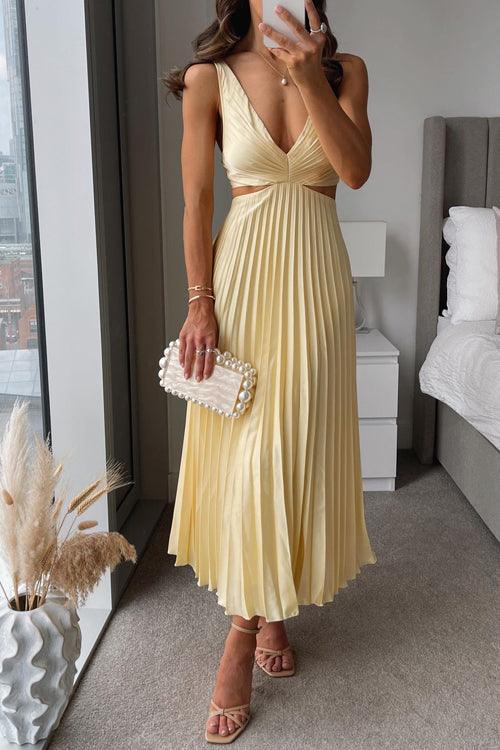 Maxi dress with V-neckline, cut-out waist, and sleeveless pleated design