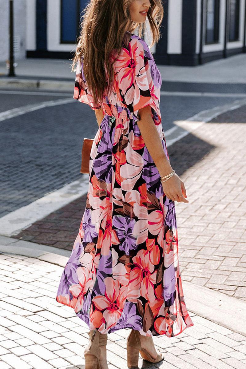 Floral dress with plunging neckline and three-quarter sleeves