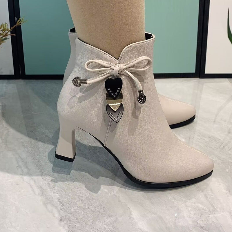 Elegant pointed toe ankle boots with chic bow detail
