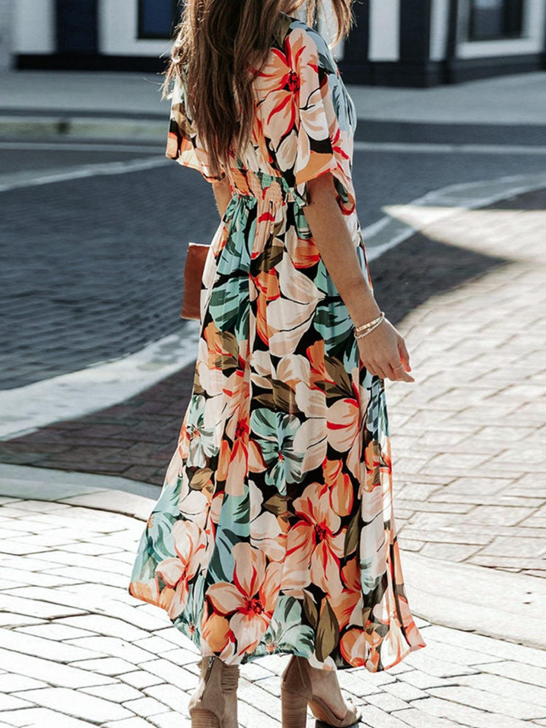 Floral dress with plunging neckline and three-quarter sleeves