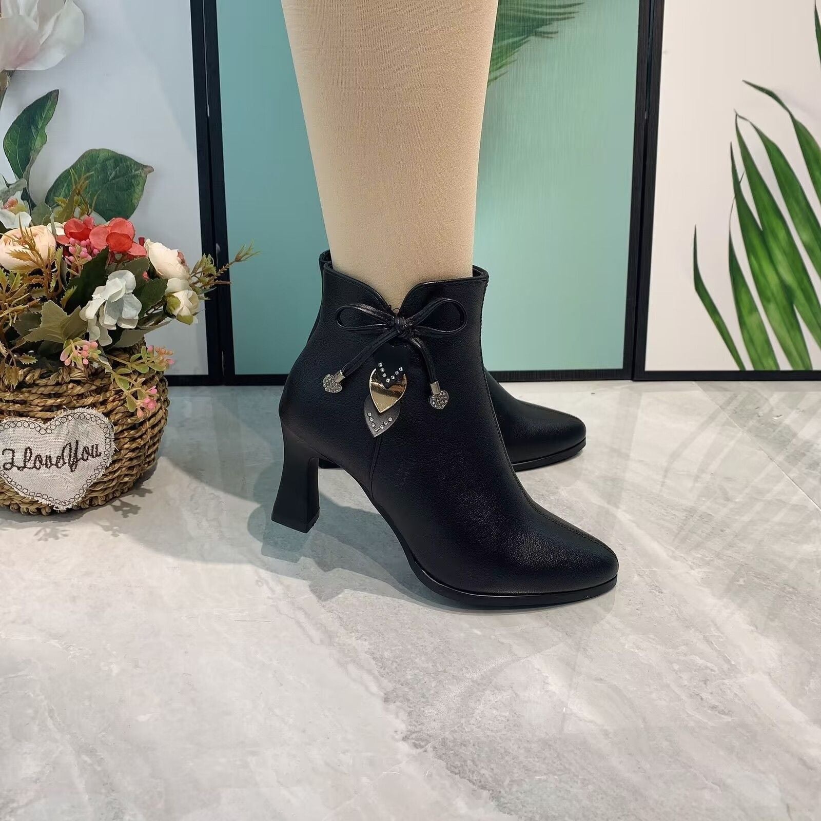 Elegant pointed toe ankle boots with chic bow detail