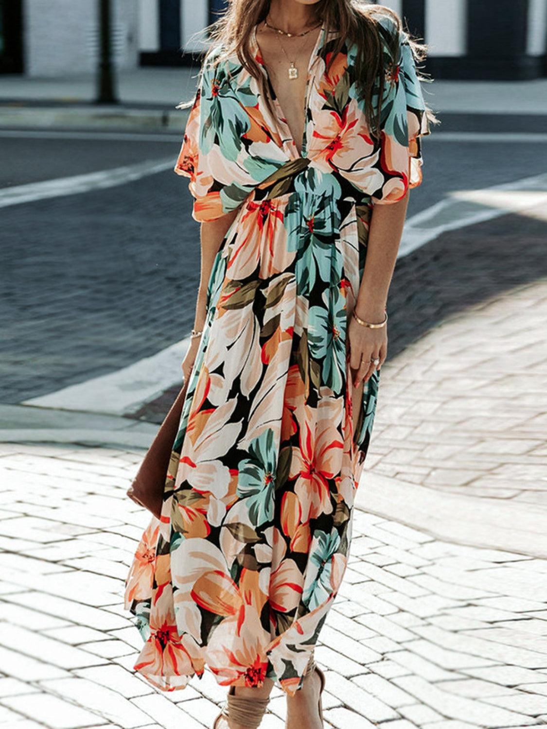 Floral dress with plunging neckline and three-quarter sleeves