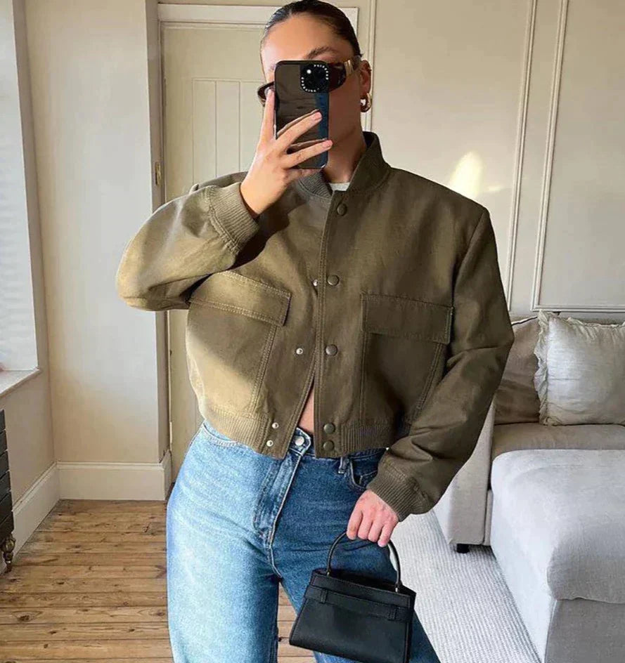 Elegant navy blue bomber jacket for women, perfect for a sophisticated casual look