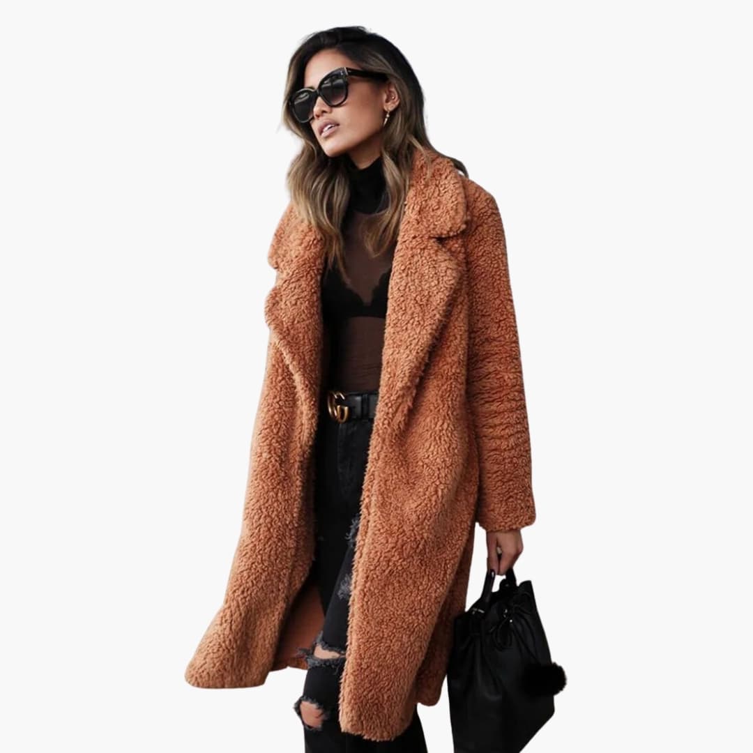 Luxurious women's long teddy fur coat with a wide collar and textured surface