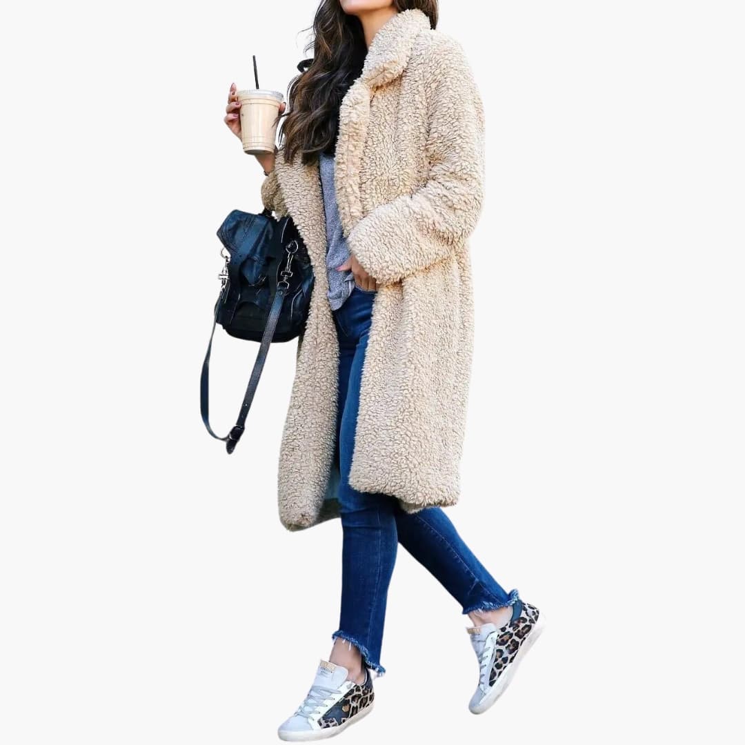 Luxurious women's long teddy fur coat with a wide collar and textured surface