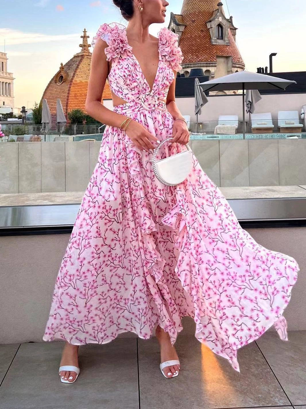 Long floral dress with a deep V-neckline and cut-out detail