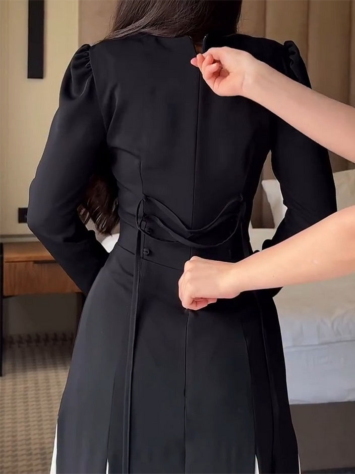 Elegant Black and White Flared Long-Sleeved Maxi Dress for a Timeless Look