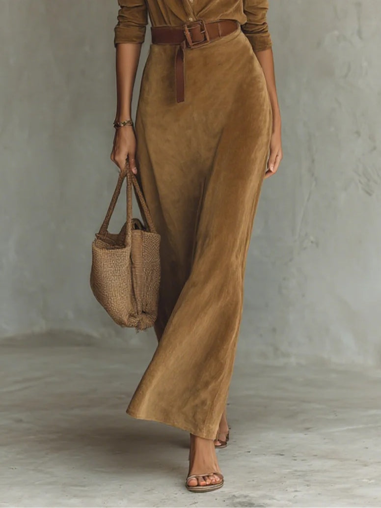 Elegant long suede maxi dress with a tie-neck collar and long sleeves