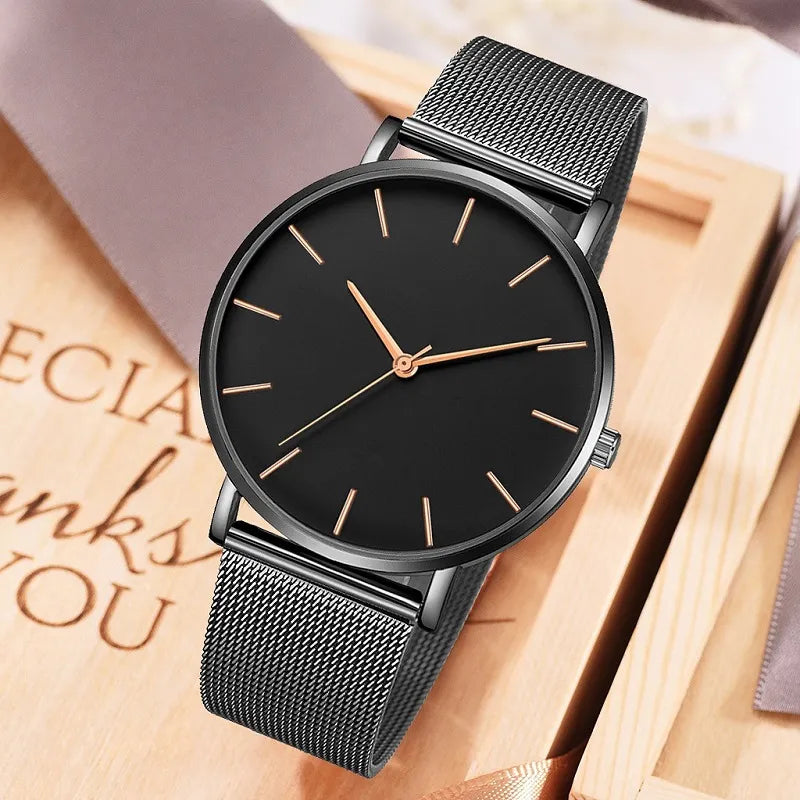 Elegant minimalist stainless steel watch with mesh bracelet